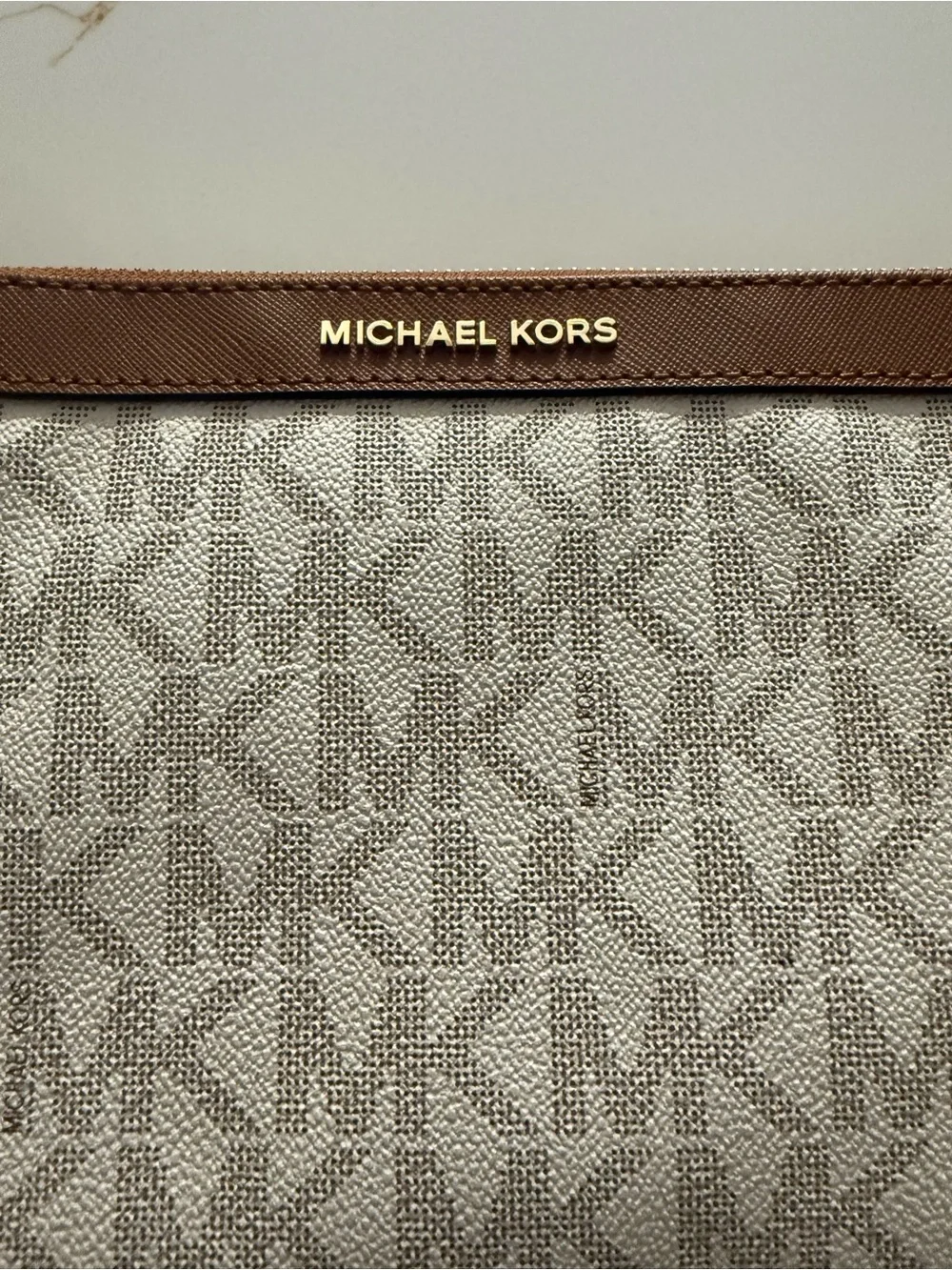 Michael Kors Beige MK Monogram clutch/wristlet with Brown Trim